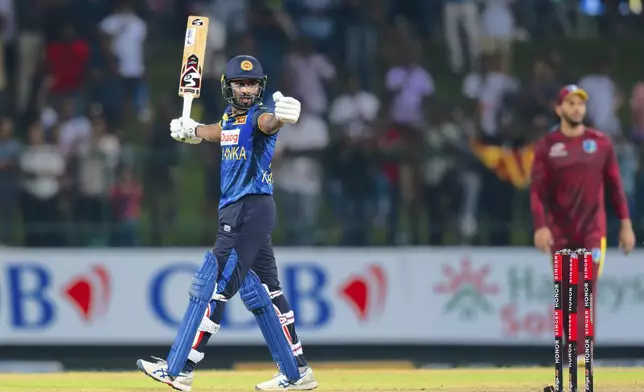 Sri Lanka's Kamindu Mendis his team's win in the first ODI cricket match between Sri Lanka and West Indies in Pallekele, Sri Lanka, Sunday, Oct. 20, 2024. (AP Photo/Viraj Kothalawala)