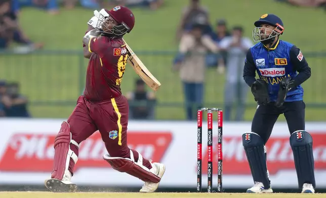 West Indies' Sherfane Rutherford plays a shot during the first ODI cricket match between Sri Lanka and West Indies in Pallekele, Sri Lanka, Sunday, Oct. 20, 2024. (AP Photo/Viraj Kothalawala)