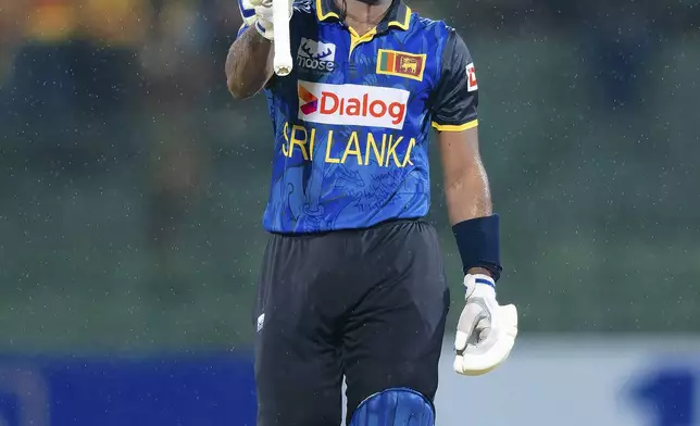 Sri Lanka's Nishan Madushka celebrates his fifty runs during the first ODI cricket match between Sri Lanka and West Indies in Pallekele, Sri Lanka, Sunday, Oct. 20, 2024. (AP Photo/Viraj Kothalawala)