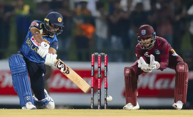 Sri Lanka's Kamindu Mendis plays a shot during the first ODI cricket match between Sri Lanka and West Indies in Pallekele, Sri Lanka, Sunday, Oct. 20, 2024. (AP Photo/Viraj Kothalawala)