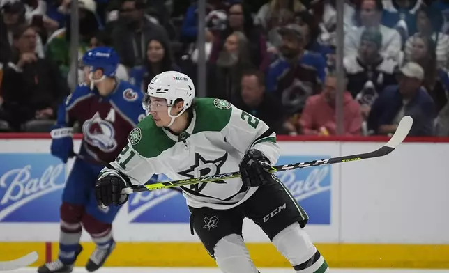 FILE - Dallas Stars left wing Jason Robertson (21) in the second period of Game 3 of an NHL hockey Stanley Cup playoff series Saturday, May 11, 2024, in Denver. (AP Photo/David Zalubowski, File)