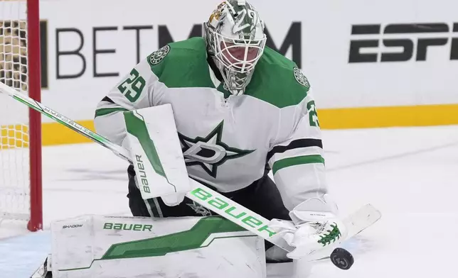 Dallas Stars goaltender Jake Oettinger (29) blocks a shot on goal during the second period of an NHL hockey game against the Nashville Predators, Thursday, Oct. 10, 2024, in Nashville, Tenn. (AP Photo/George Walker IV)