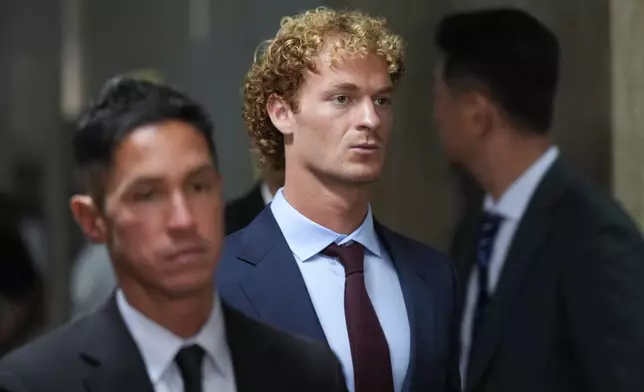 Daniel Penny leaves the courtroom during a break in New York, Monday, Oct. 21, 2024. Jury selection is set to begin in the criminal trial of the U.S. Marine Corps veteran who placed a man in a deadly chokehold aboard a New York City subway train last year. (AP Photo/Seth Wenig)