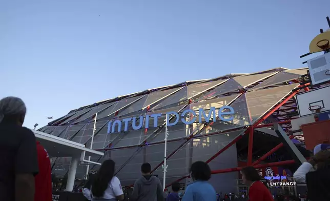 Fans line up at the Intuit Dome before an NBA basketball game between the Los Angeles Clippers and the Phoenix Suns, Wednesday, Oct. 23, 2024, in Inglewood, Calif. (AP Photo/Ryan Sun)