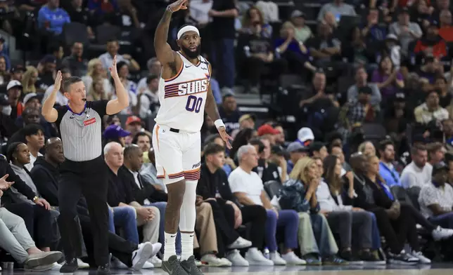 Phoenix Suns forward Royce O'Neale celebrates after a three-point basket during the first half of an NBA basketball game against the LA Clippers, Wednesday, Oct. 23, 2024, in Inglewood, Calif. (AP Photo/Ryan Sun)