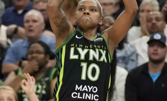 Minnesota Lynx guard Courtney Williams (10) shoots during the second half of Game 5 of a WNBA basketball semifinals against the Connecticut Sun, Tuesday, Oct. 8, 2024, in Minneapolis. (AP Photo/Abbie Parr)