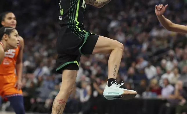 Minnesota Lynx guard Natisha Hiedeman (2) shoots the ball during the second half of Game 2 of a WNBA basketball semifinals game against the Connecticut Sun, Tuesday, Oct. 1, 2024, in Minneapolis. (AP Photo/Adam Bettcher)