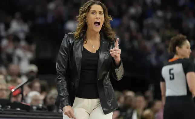 Connecticut Sun head coach Stephanie White reacts after a foul called on the Sun during the first half of Game 5 of a WNBA basketball semifinals against the Minnesota Lynx, Tuesday, Oct. 8, 2024, in Minneapolis. (AP Photo/Abbie Parr)