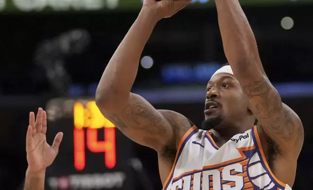 Phoenix Suns guard Bradley Beal (3) shoots over Los Angeles Lakers guard Gabe Vincent during the first half of an NBA basketball game against the in Los Angeles, Friday, Oct. 25, 2024. (AP Photo/Eric Thayer)