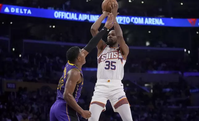 Phoenix Suns forward Kevin Durant (35) shoots over Los Angeles Lakers forward Rui Hachimura (28) during the first half of an NBA basketball game against the in Los Angeles, Friday, Oct. 25, 2024. (AP Photo/Eric Thayer)