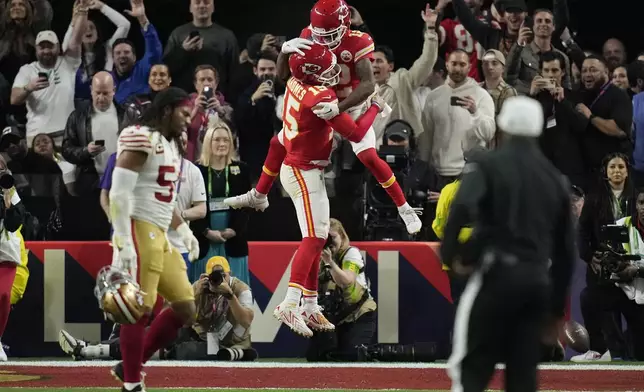 FILE - Kansas City Chiefs quarterback Patrick Mahomes celebrates with wide receiver Mecole Hardman Jr. after Hardman scored the game-winning touchdown against the San Francisco 49ers in overtime during the NFL Super Bowl 58 football game, Feb. 11, 2024, in Las Vegas. (AP Photo/John Locher, File)