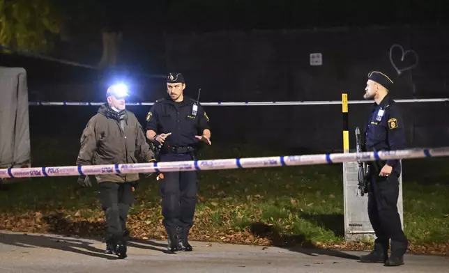 Police guard outside the Israeli embassy in Stockholm, Sweden, Tuesday, Oct. 1, 2024, after a suspected shooting near the embassy. (Anders Wiklund/TT News Agency via AP)