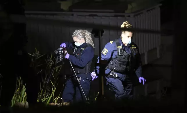 Police work outside the Israeli embassy in Stockholm, Sweden, Tuesday, Oct. 1, 2024, after a suspected shooting near the embassy. (Anders Wiklund/TT News Agency via AP)