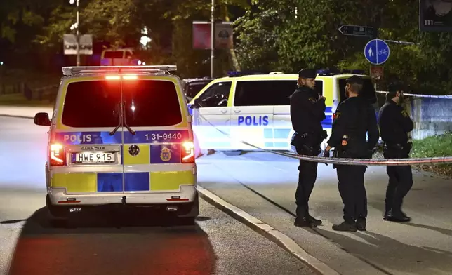 Police guard outside the Israeli embassy in Stockholm, Sweden, Tuesday, Oct. 1, 2024, after a suspected shooting near the embassy. (Anders Wiklund/TT News Agency via AP)