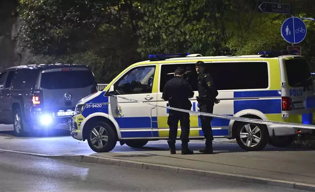 Police guard outside the Israeli embassy in Stockholm, Sweden, Tuesday, Oct. 1, 2024, after a suspected shooting near the embassy. (Anders Wiklund/TT News Agency via AP)