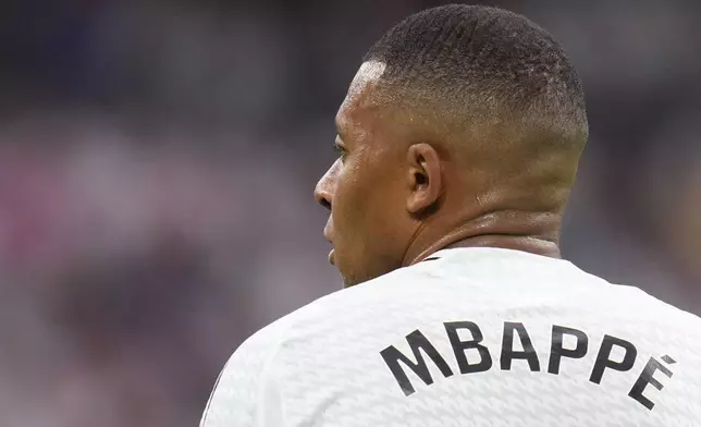 FILE - Real Madrid's Kylian Mbappe attends the Spanish La Liga soccer match between Real Madrid and Valladolid at the Santiago Bernabeu stadium in Madrid, Spain, Sunday, Aug. 25, 2024. (AP Photo/Manu Fernandez, File)