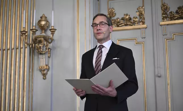 Swedish Academy's permanent secretary Mats Malm announces the winner of the 2024 Nobel Prize in Literature, South Korean writer Han Kang at the Swedish Academy in Stockholm, Sweden, Thursday Oct. 10, 2024. (Jessica Gow/TT News Agency via AP)