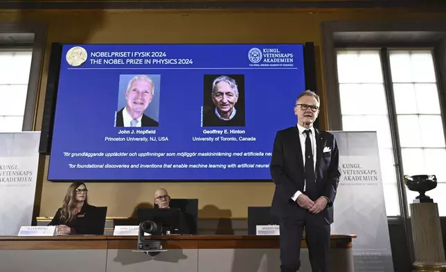 Professor Anders Irbäck explains the work of John Hopfield and Geoffrey Hinton after being awarded the 2024 Nobel Prize in Physics at a press conference at the Royal Swedish Academy of Sciences in Stockholm, Sweden Tuesday Oct. 8, 2024. (Christine Olsson/TT News Agency via AP)