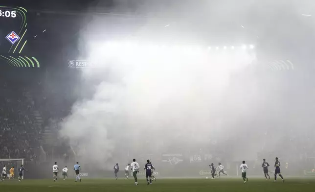 View of the stadium after fans of Fiorentina used pyrotechnics during the Europa Conference League opening phase soccer match between FC St. Gallen and Fiorentina, at the Kybunpark stadium in St. Gallen, Switzerland, Thursday, Oct. 24, 2024. (Gian Ehrenzeller/Keystone via AP)