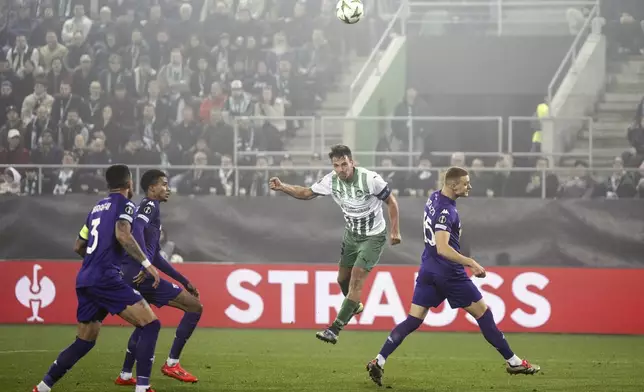 St. Gallen's Lukas Goertler, second right, shoots to score their side's second goal of the game during the Europa Conference League opening phase soccer match between FC St. Gallen and Fiorentina, at the Kybunpark stadium in St. Gallen, Switzerland, Thursday, Oct. 24, 2024. (Gian Ehrenzeller/Keystone via AP)