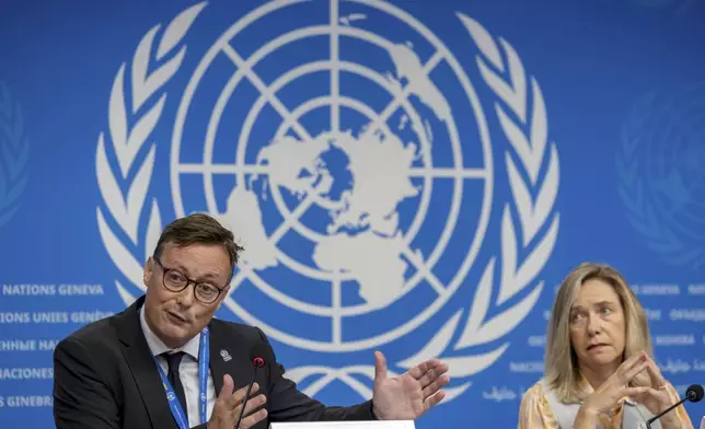 Stefan Uhlenbrook, left, director of Hydrology, Water and Cryosphere at the World Meteorological Organization (WMO), sits next to WMO Secretary-General Celeste Saulo as he presents the WMO's State of Global Water Resources report during a press conference at the European headquarters of the United Nations in Geneva, Switzerland, Monday, Oct. 7, 2024. (Salvatore Di Nolfi/Keystone via AP)