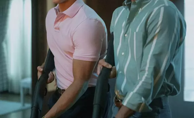 This image released by Netflix shows Cooper Koch as Erik Menendez, right, and Nicholas Chavez as Lyle Menendez in a scene from "Monsters: The Lyle And Erik Menendez Story." (Miles Crist/Netflix via AP)