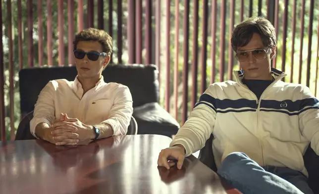 This image released by Netflix shows Cooper Koch as Erik Menendez, left, and Nicholas Chavez as Lyle Menendez in a scene from "Monsters: The Lyle And Erik Menendez Story." (Miles Crist/Netflix via AP)