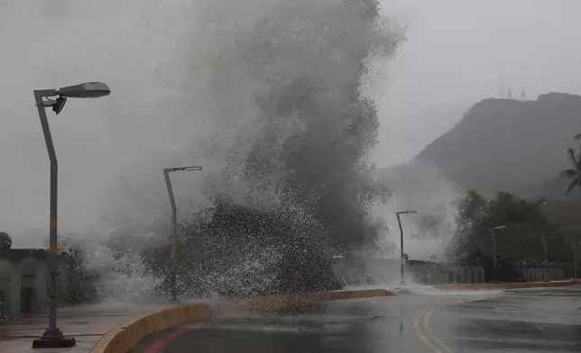 Waves crash on the coastline in Kaohsiung, southern Taiwan, Wednesday, Oct. 2, 2024, as Typhoon Krathon approaches to Taiwan. (AP Photo/Chiang Ying-ying)