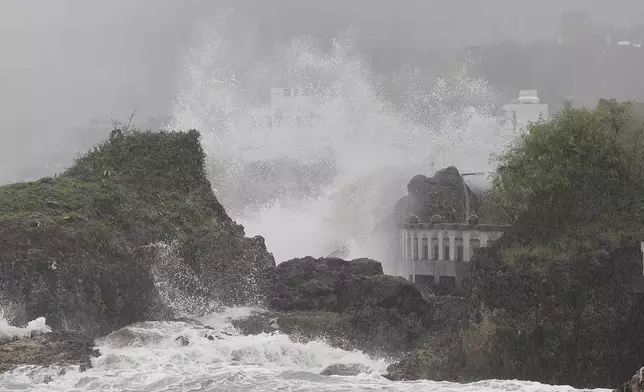 Waves crash on the coastline in Kaohsiung, southern Taiwan, Wednesday, Oct. 2, 2024, as Typhoon Krathon approaches to Taiwan. (AP Photo/Chiang Ying-ying)