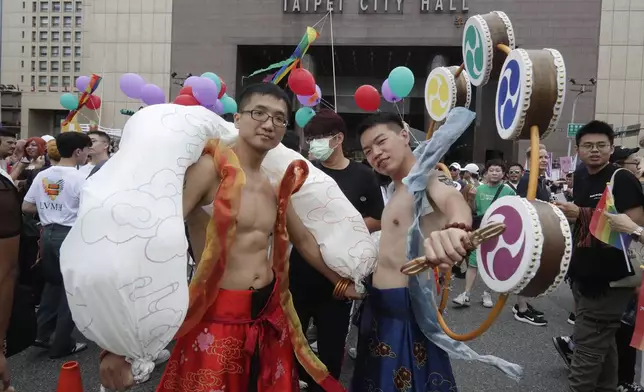 Participants pose during the annual Taiwan LGBT Pride parade in Taipei, Taiwan, Saturday, Oct. 26, 2024. (AP Photo/Chiang Ying-ying)