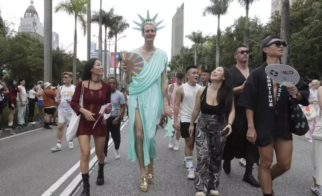 Participants attend the annual Taiwan LGBT Pride parade in Taipei, Taiwan, Saturday, Oct. 26, 2024. (AP Photo/Chiang Ying-ying)