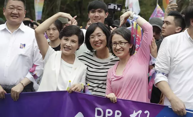 Taiwan Vice President Hsiao Bi-khim, first from right, cheers during the annual Taiwan LGBT Pride parade in Taipei, Taiwan, Saturday, Oct. 26, 2024. (AP Photo/Chiang Ying-ying)