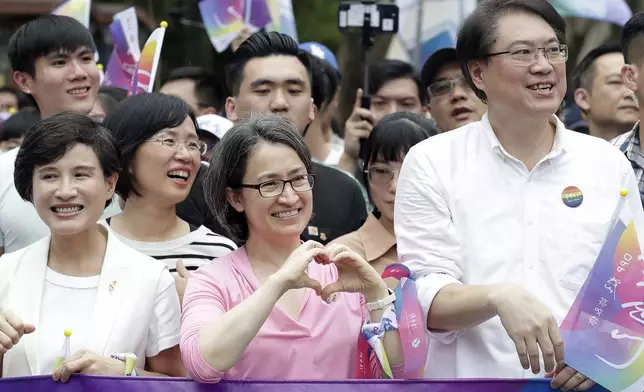 Taiwan Vice President Hsiao Bi-khim, center, cheers during the annual Taiwan LGBT Pride parade in Taipei, Taiwan, Saturday, Oct. 26, 2024. (AP Photo/Chiang Ying-ying)