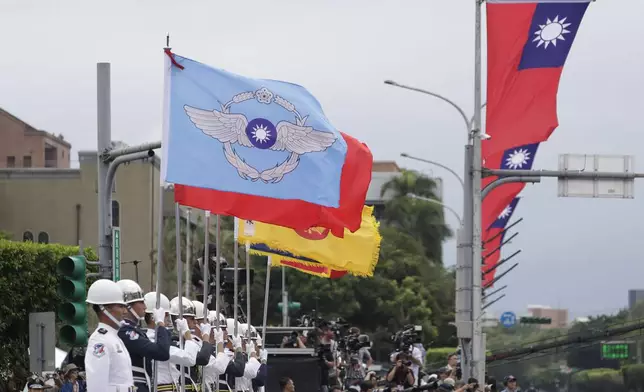 A military honor guard attends National Day celebrations in front of the Presidential Building in Taipei, Taiwan, Thursday, Oct. 10, 2024. (AP Photo/Chiang Ying-ying)