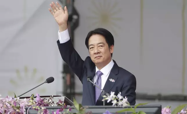 Taiwanese President Lai Ching-te waves during National Day celebrations in front of the Presidential Building in Taipei, Taiwan, Thursday, Oct. 10, 2024. (AP Photo/Chiang Ying-ying)