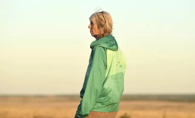 Dr. Cara Shillington, a biology professor at Eastern Michigan University, surveys the plains during tarantula mating season near La Junta, Colo., on Saturday, Sept. 28, 2024. (AP Photo/Thomas Peipert)