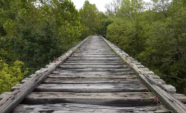 The Monon High Bridge at the end of the Monon High Bridge Trail is shown in Delphi, Ind., Tuesday, Oct. 1, 2024. (AP Photo/Michael Conroy)