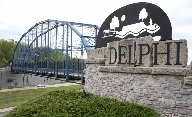 A sign announcing the town of Delphi, Ind., along Indiana State Road 25 is shown Tuesday, Oct. 1, 2024. (AP Photo/Michael Conroy)