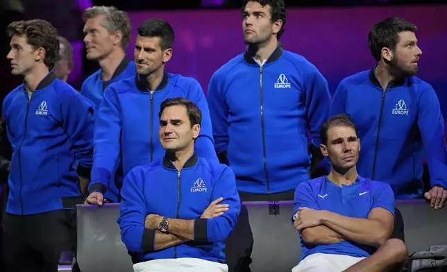 FILE - An emotional Roger Federer, left, of Team Europe sits alongside his playing partner Rafael Nadal after their Laver Cup doubles match against Team World's Jack Sock and Frances Tiafoe at the O2 arena in London, Friday, Sept. 23, 2022. (AP Photo/Kin Cheung, File)