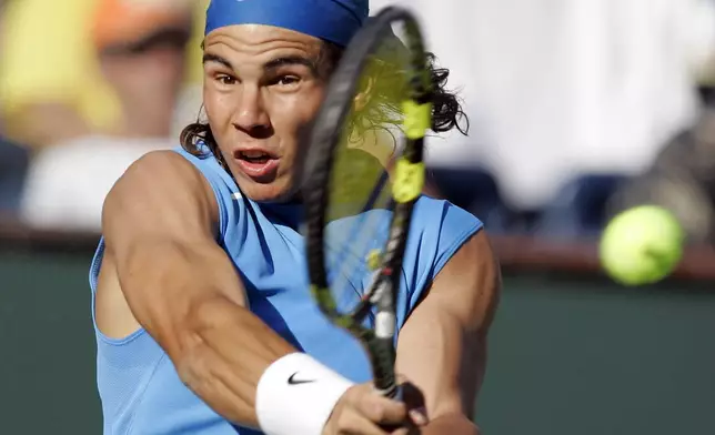 FILE - Rafael Nadal, of Spain, returns a shot to Amaud Clement, of France, during second round play the Pacific Life Open tennis tournament, Saturday, March 10, 2007, in Indian Wells, Calif., as he has announced he will retire from tennis at age 38 following the Davis Cup finals in November. (AP Photo/Mark J. Terrill, File)