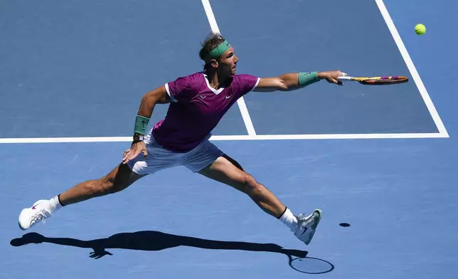 FILE - Rafael Nadal of Spain plays a backhand return to Yannick Hanfmann of Germany during their second round match at the Australian Open tennis championships in Melbourne, Australia, Wednesday, Jan. 19, 2022. (AP Photo/Andy Brownbill, File)