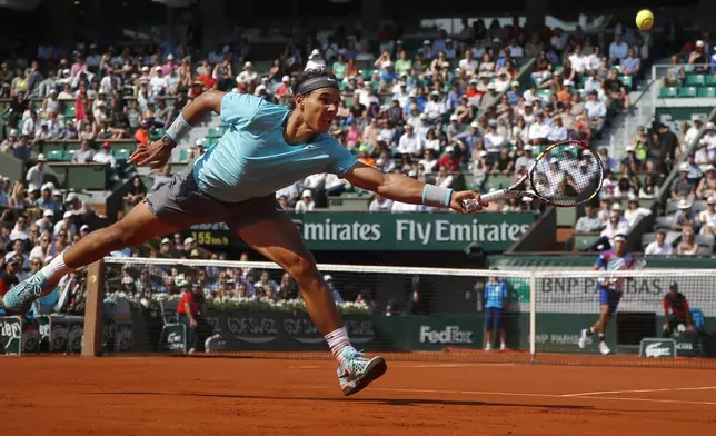 FILE - Spain's Rafael Nadal returns the ball during the third round match of the French Open tennis tournament against Argentina's Leonardo Mayer at the Roland Garros stadium, in Paris, France, Saturday, May 31, 2014, as he has announced he will retire from tennis at age 38 following the Davis Cup finals in November. (AP Photo/Michel Euler, File)