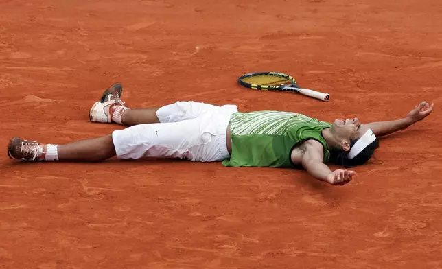 FILE - Spain's Rafael Nadal reacts as he defeats Argentina's Mariano Puerta during their final match of the French Open tennis tournament, at the Roland Garros stadium, Sunday June 5, 2005 in Paris. ( AP Photo/Christophe Ena, File)