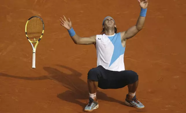 FILE - Spain's Rafael Nadal reacts as he defeats Switzerland's Roger Federer during the men's final match of the French Open tennis tournament at Roland Garros stadium in Paris, Sunday, June 10, 2007. (AP Photo/David Vincent, File)