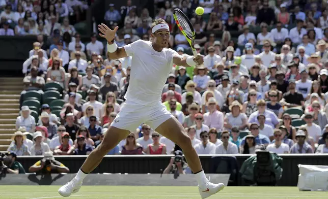 FILE - Rafael Nadal, of Spain, returns the ball to Dudi Sela, of Israel, during their men's singles match, on the second day of the Wimbledon Tennis Championships in London, Tuesday July 3, 2018. (AP Photo/Ben Curtis, File)