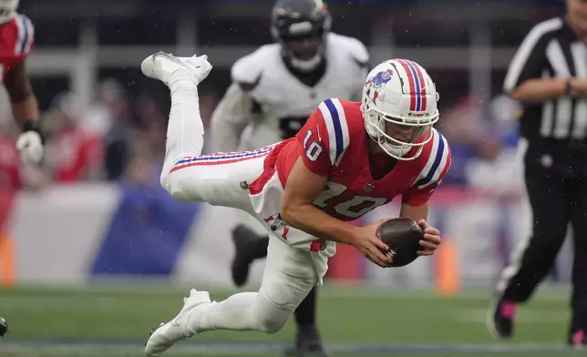 New England Patriots quarterback Drake Maye (10) carries the ball during the second half of an NFL football game against the Houston Texans, Sunday, Oct. 13, 2024, in Foxborough, Mass. (AP Photo/Steven Senne)