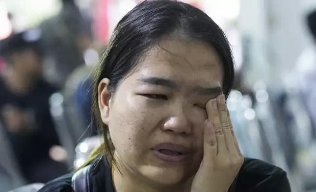 Oy Kaewprasert, mother of one of the victims of the school bus fire cries during an interview with the Associated Press at Wat Khao Phraya Sangkharam School, Lan Sak, Uthai Thani province, Thailand, Thursday, Oct. 3, 2024. (AP Photo/Sakchai Lalit)