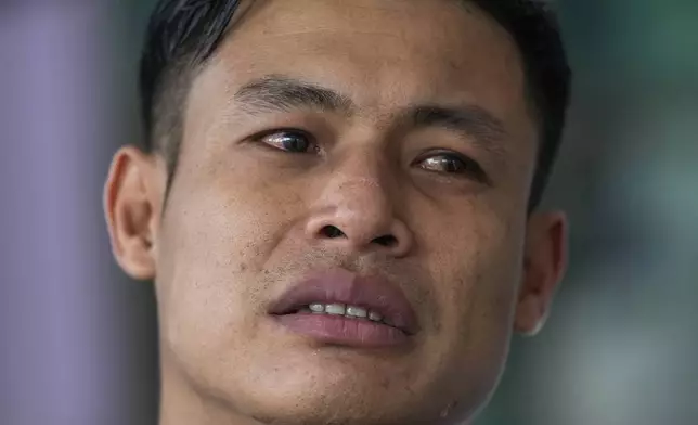 Wichan Seubsaichan, father of one of the victims of the school bus fire cries during an interview with the Associated Press at Wat Khao Phraya Sangkharam School, Lan Sak, Uthai Thani province, Thailand, Thursday, Oct. 3, 2024. (AP Photo/Sakchai Lalit)