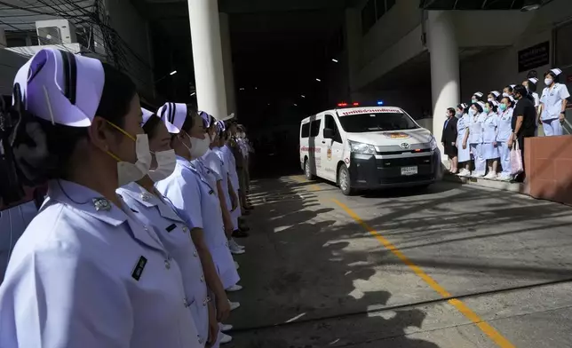 An ambulance carrying a body leaves from the Police hospital in Bangkok, Thailand, Wednesday, Oct. 2, 2024, (AP Photo/Sakchai Lalit)