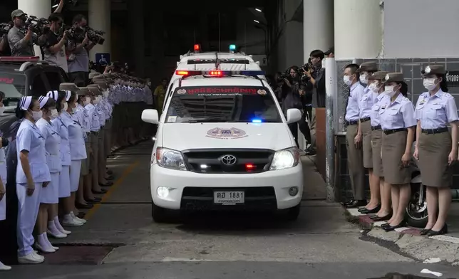 An ambulance carrying a body leaves from the Police hospital in Bangkok, Thailand, Wednesday, Oct. 2, 2024, (AP Photo/Sakchai Lalit)